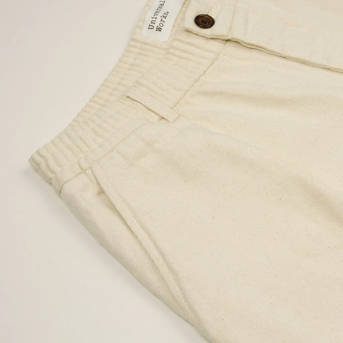 Ecru Universal Works Pleated Track Shorts Made of Recycled Cotton