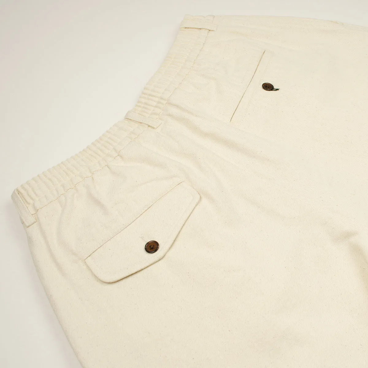 Ecru Universal Works Pleated Track Shorts Made of Recycled Cotton